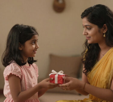 A young girl receiving a small gift from her tired mother